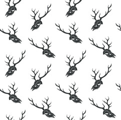 Vector seamless pattern of hand drawn sketch doodle deer skull isolated on white background