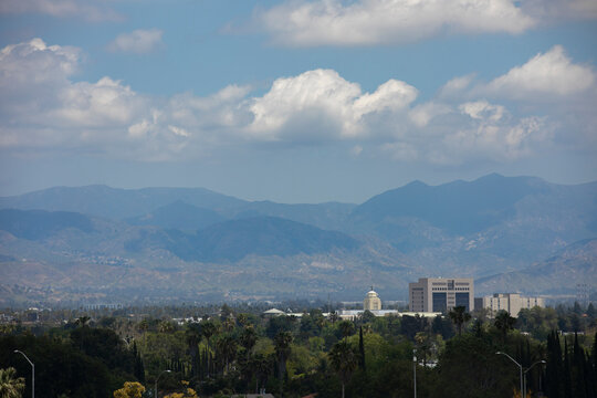 Sweltering heat rises from the valley in front of the downtown skyline of Van Nuys, Los Angeles, California, USA.