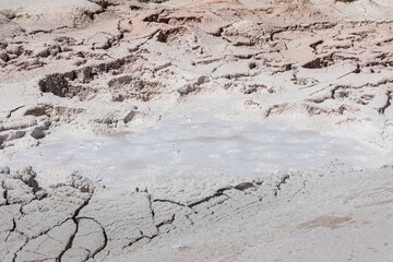 Photograph Close up of a mud pot bubbling on the fountain paint pot trail in Yellowstone.