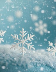 Minimalist winter background with depth of field featuring soft snowflakes on a light blue backdrop