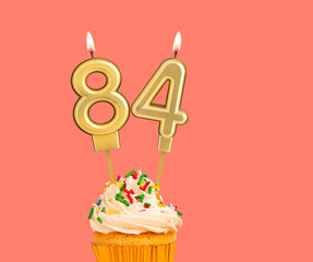 Birthday number 84 - Golden candle with cupcake