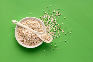 Sagu starch balls - Tapioca pearls in the bowl and spoon. Manihot esculenta.