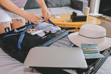 A Woman Packing a Suitcase for a Vacation Getaway