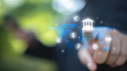 A person is pointing at a map of the world with a bunch of different currencies