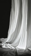 Flowing white fabric with dramatic shadows