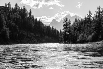 Black and white photo of the snake river and the Tetons in the background. Grand Teton National Park Wyoming 