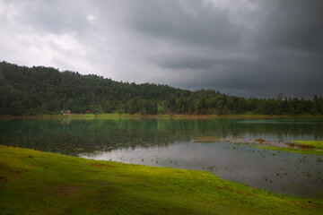 Rainy afternoon by the volcanic lagoon. Laguna Larga. Los azufres.