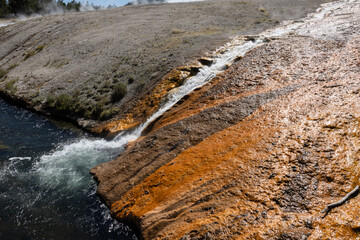 Excelsior geyser crater runoff into the firehouse river at Yellowstone national park in Wyoming 