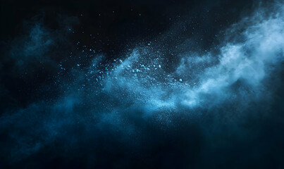 Blue powder explosion on black background.