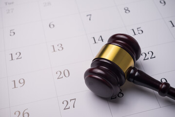 Judge wood gavel hammer on white blank calendar background copy space. Law, judgement, agenda...