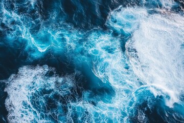 Obraz premium Ocean Waves From Above: A Whirl of Blue and White