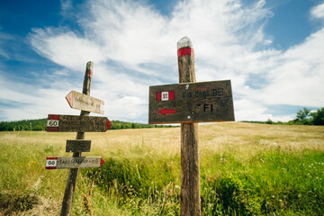 Direction sign on the Via degli Dei or The Gods way in the Apennines mountains in Italy, between...
