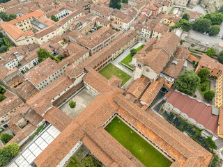 Aerial view of San Salvatore basilica, Roman amphitheater in medieval Brescia historic town center in Italy 