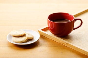 Cup of delicious hot chocolate, Cookies on wooden table background. Copy space.