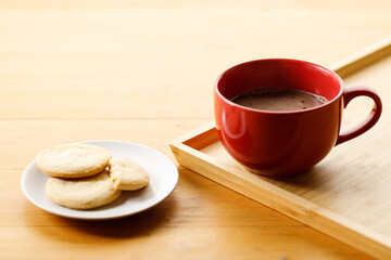Cup of delicious hot chocolate, Cookies on wooden table background. Copy space.