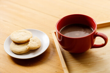 Cup of delicious hot chocolate, Cookies on wooden table background. Copy space.