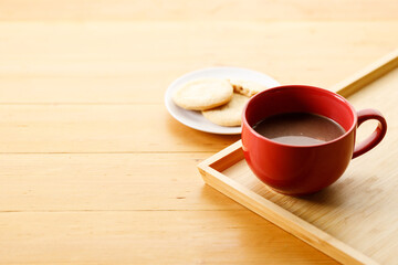 Cup of delicious hot chocolate, Cookies on wooden table background. Copy space.