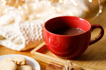 Cup of delicious hot chocolate, Cookies on wooden table background.