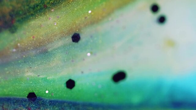 Vertical video. Glitter fluid spill. Color background. Defocused bright golden orange pink blue shimmering sequin ink blend wave motion abstract art texture.