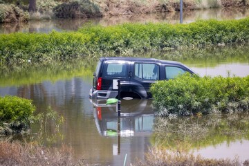 SUV Submerged in Floodwaters