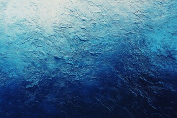Abstract blue textured background with a gradient from light to dark blue.