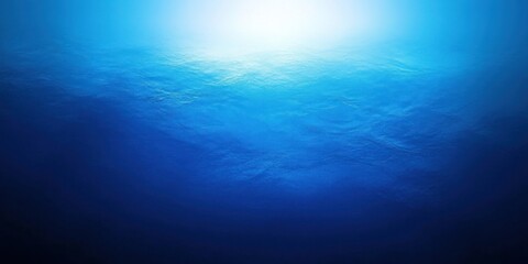 Fototapeta premium A Bright Light Shining Through Deep Blue Ocean Water