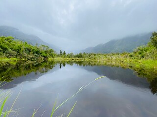Peters Pool at Franz Josef Grecier, west coast, South Island, New Zealand, lake in the mountains