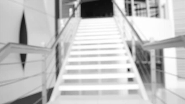 Blurred image of stairs in an office building.