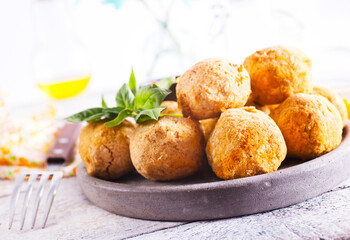fried organic falafel balls on white wooden table