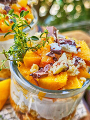 Dessert with peaches and yogurt on a wooden table