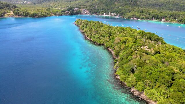 Emerald Sea Water Meet Rocky Island Shoreline