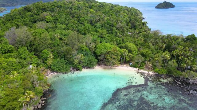 Tropical Island Beach Framed by Emerald Green Sea