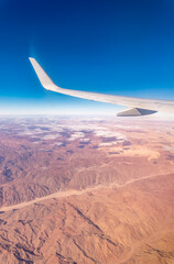 Aerial view on arabian desert and Red sea mountains from airplane