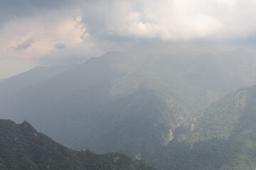 Obraz premium Landscape of foggy mountains in Aba Tibetan and Qiang Autonomous Prefectures. West part of Sichuan province, China
