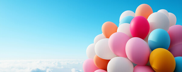 A colorful assortment of pastel balloons floats against a bright blue sky, evoking a sense of joy and celebration.