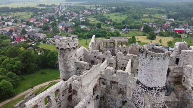 Reverse flight over ruins of Ogrodzieniec medieval castle  (the one from Witcher movie series)