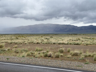 Road in the steppes, overcast weather. 