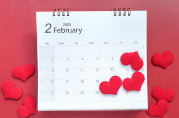 Valentines day background. February,14 2025 calendar schedule and red heart on red background. Flat lay, top view 