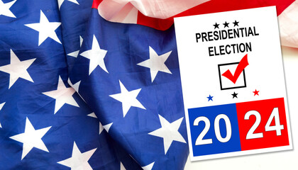 Politics and voting concept. Presidential election 2024 text on white paper over the American flag background