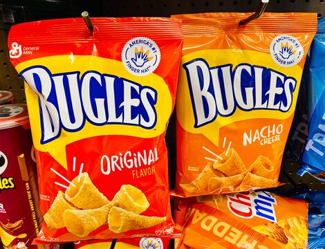 Bags of Bugles original and nacho cheese chips on display.
