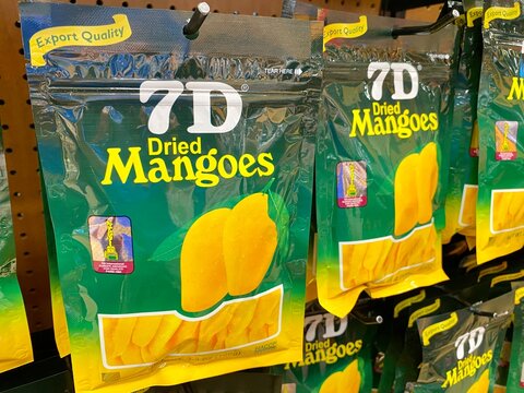 7D Dried Mango pouches on display.