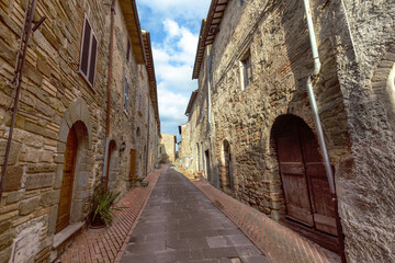 The narrow alleyways of Collemancio reveal beautifully preserved medieval architecture set against...