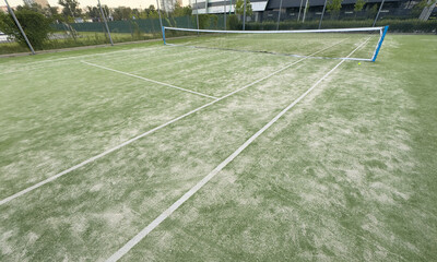 tennis court on the edge of a recreation center