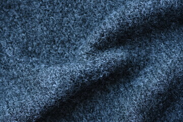  close-up of gray crocheted front surface, woolen texture of woolen wool, knitted front surface, macro texture of woolen dark gray crocheted sweater as background
