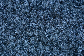 close-up of gray crocheted front surface, woolen texture of woolen wool, knitted front surface, macro texture of woolen dark gray crocheted sweater as background