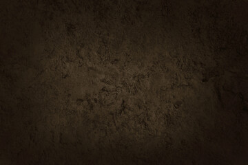 Dark brown slate stone wall texture background in natural pattern for decorative interior and exterior.