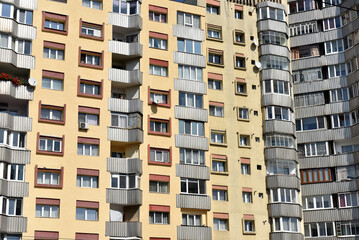 Fototapeta premium Typical facade of concrete panel building. Post Soviet flat of blocks