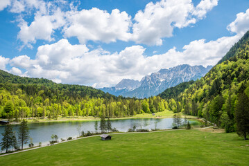 stunning alpine landscape lake ferchensee, Karwendel alps, blue sky with clouds.