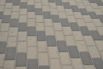 Close-up of a sidewalk and road markings, bike path, blind lane, pedestrian crossing, road texture, paving slabs