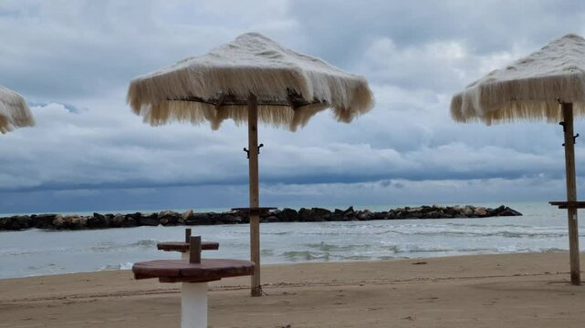 STORM SEA IN WINTER STRAW UMBRELLAS